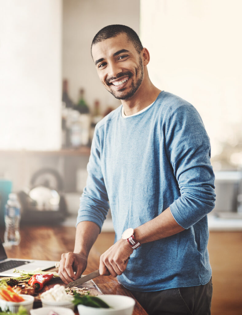 smiling man cooking