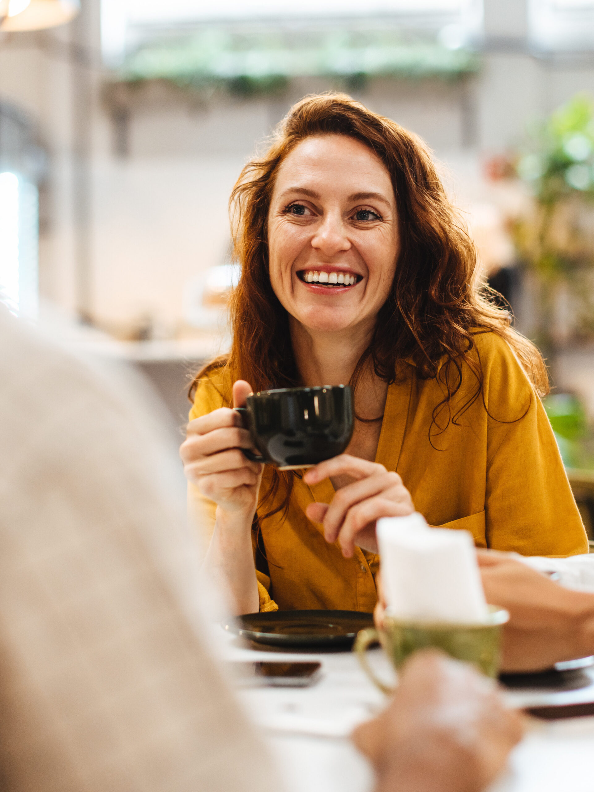 Woman having coffee with friends